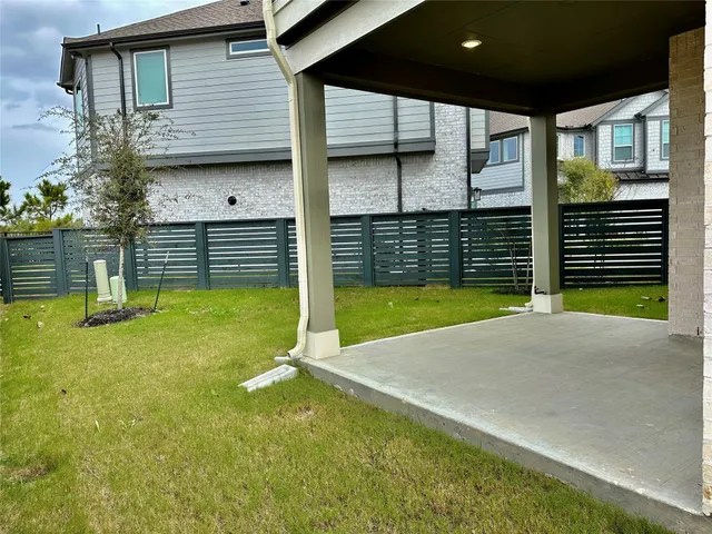 a view of a backyard with a garden and plants