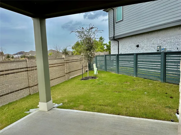 a view of a backyard with a garden and plants