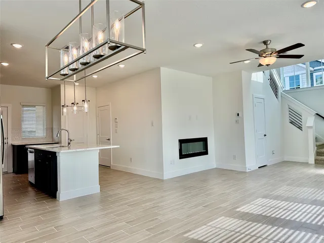 a view of a kitchen with a sink and cabinets