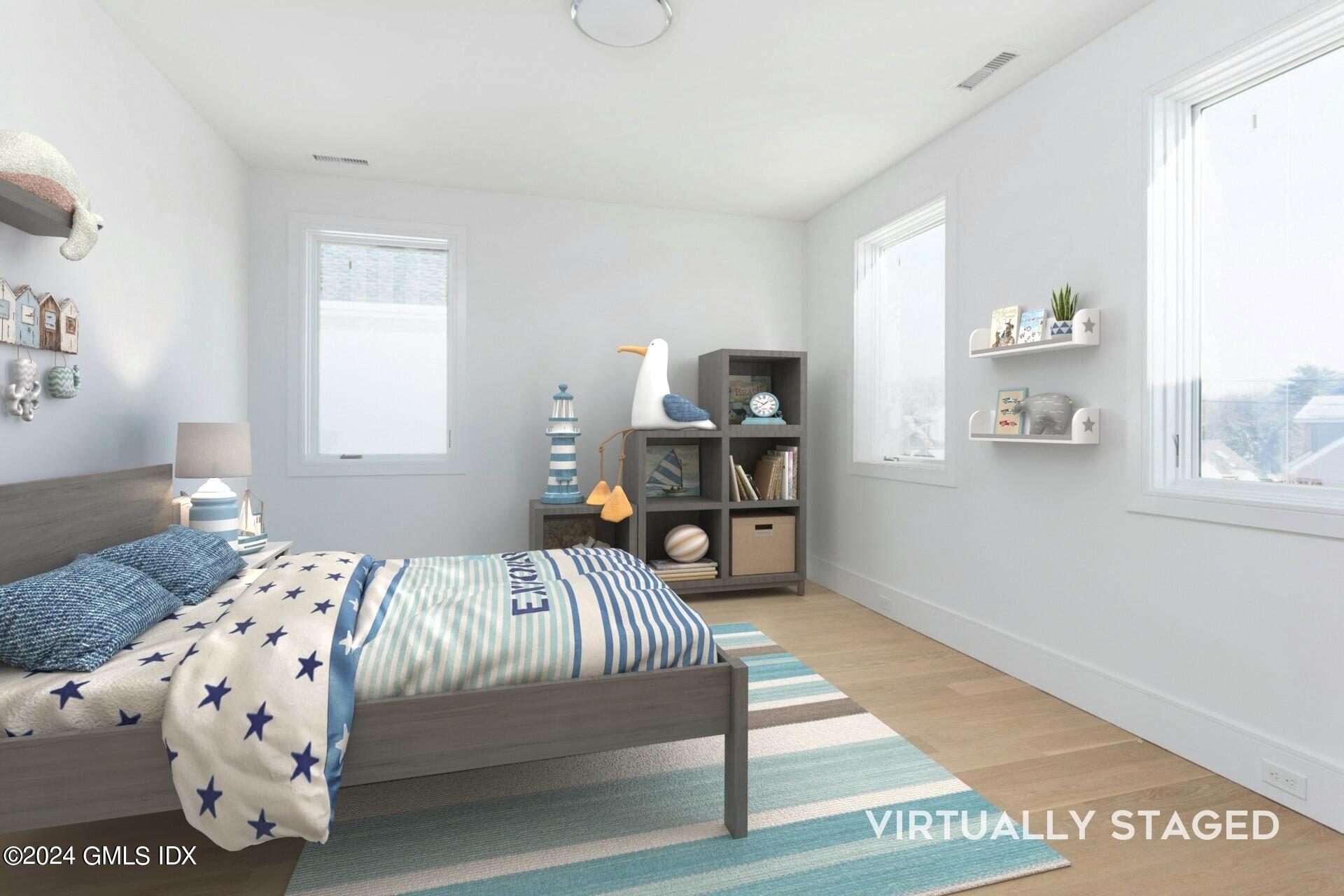 151 East Elm Street Greenwich, CT 06830 - Photo 15 of 29 a bedroom with a bed and a window
