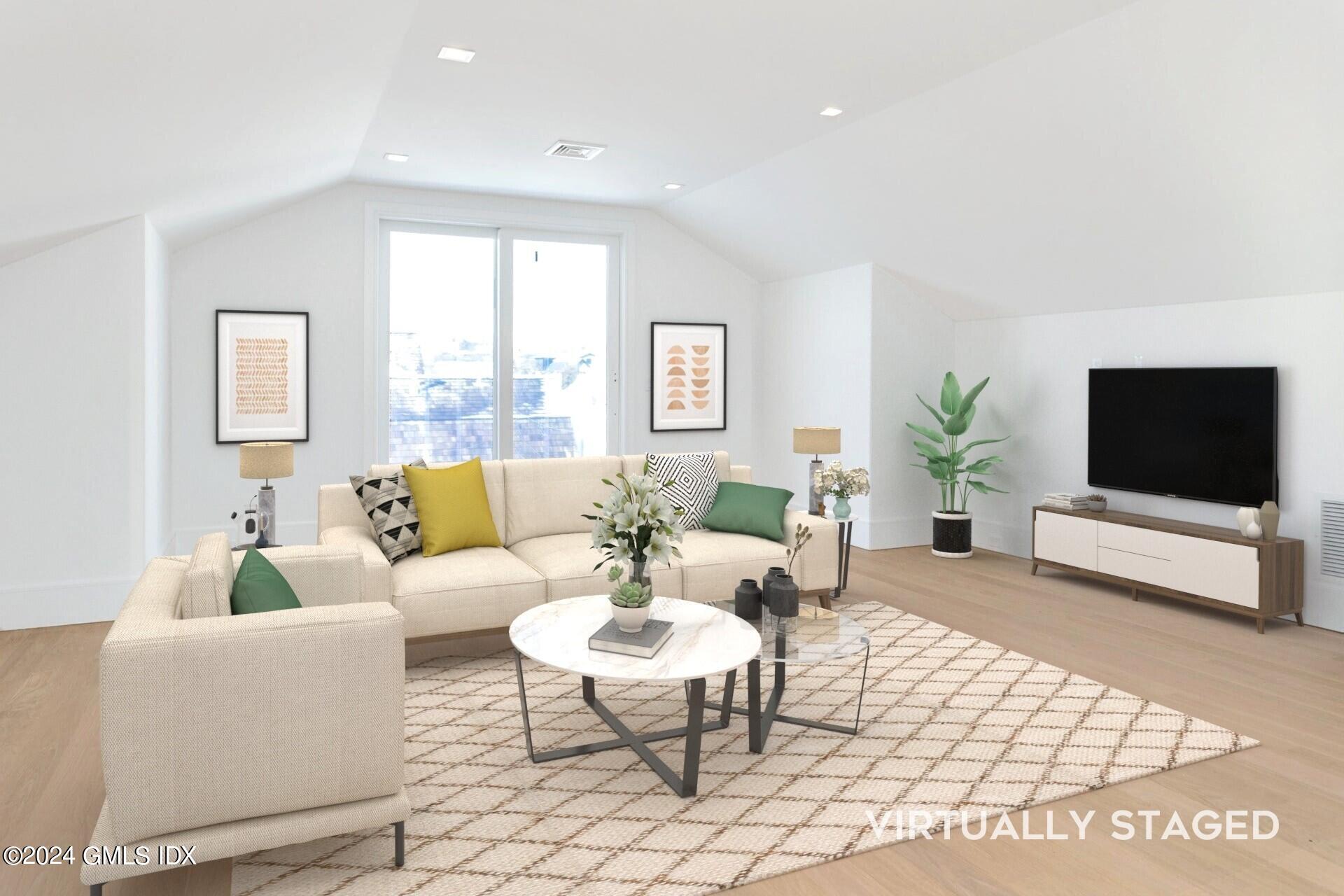 151 East Elm Street Greenwich, CT 06830 - Photo 18 of 29 a living room with furniture and a flat screen tv