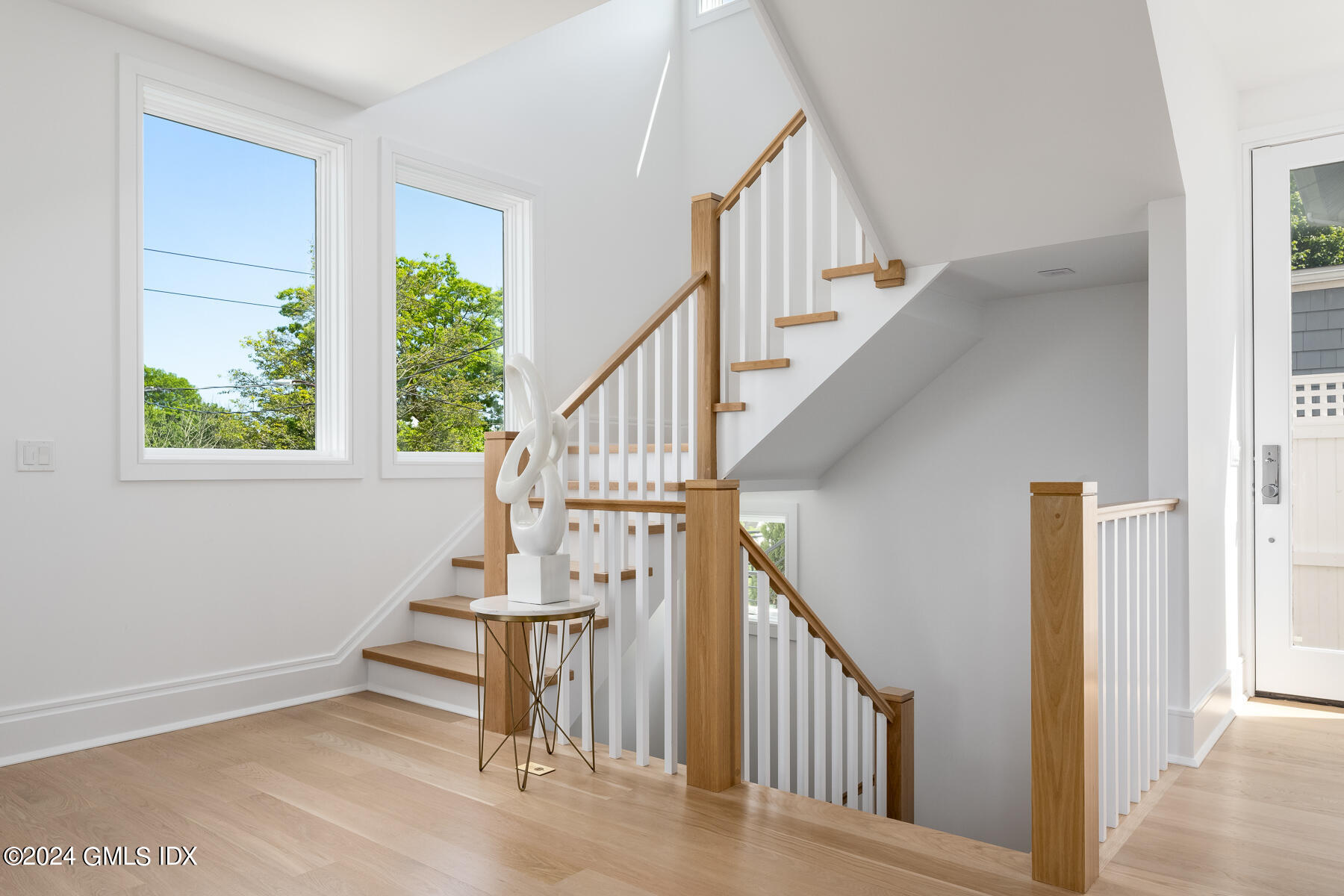 151 East Elm Street Greenwich, CT 06830 - Photo 2 of 29 a view of entryway and hall with wooden floor