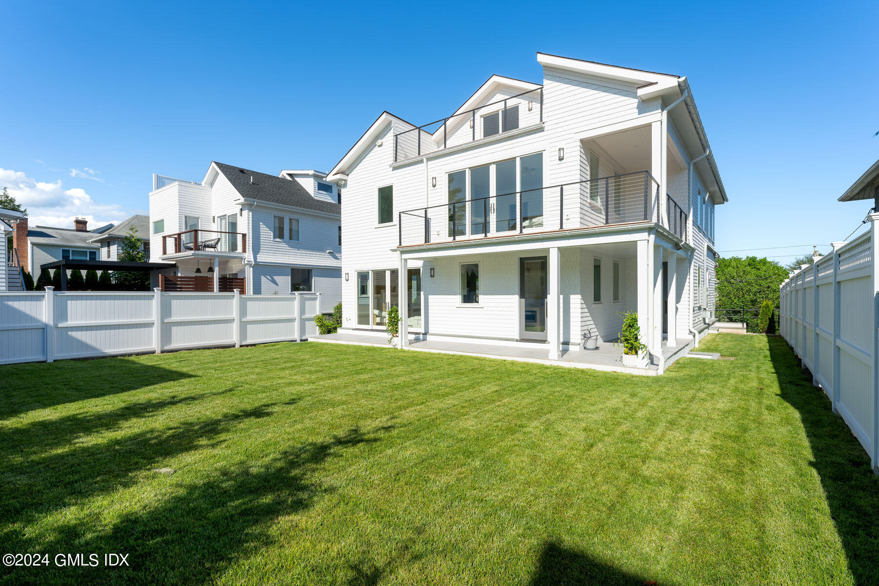 151 East Elm Street Greenwich, CT 06830 - Photo 24 of 29 a view of a house with a yard