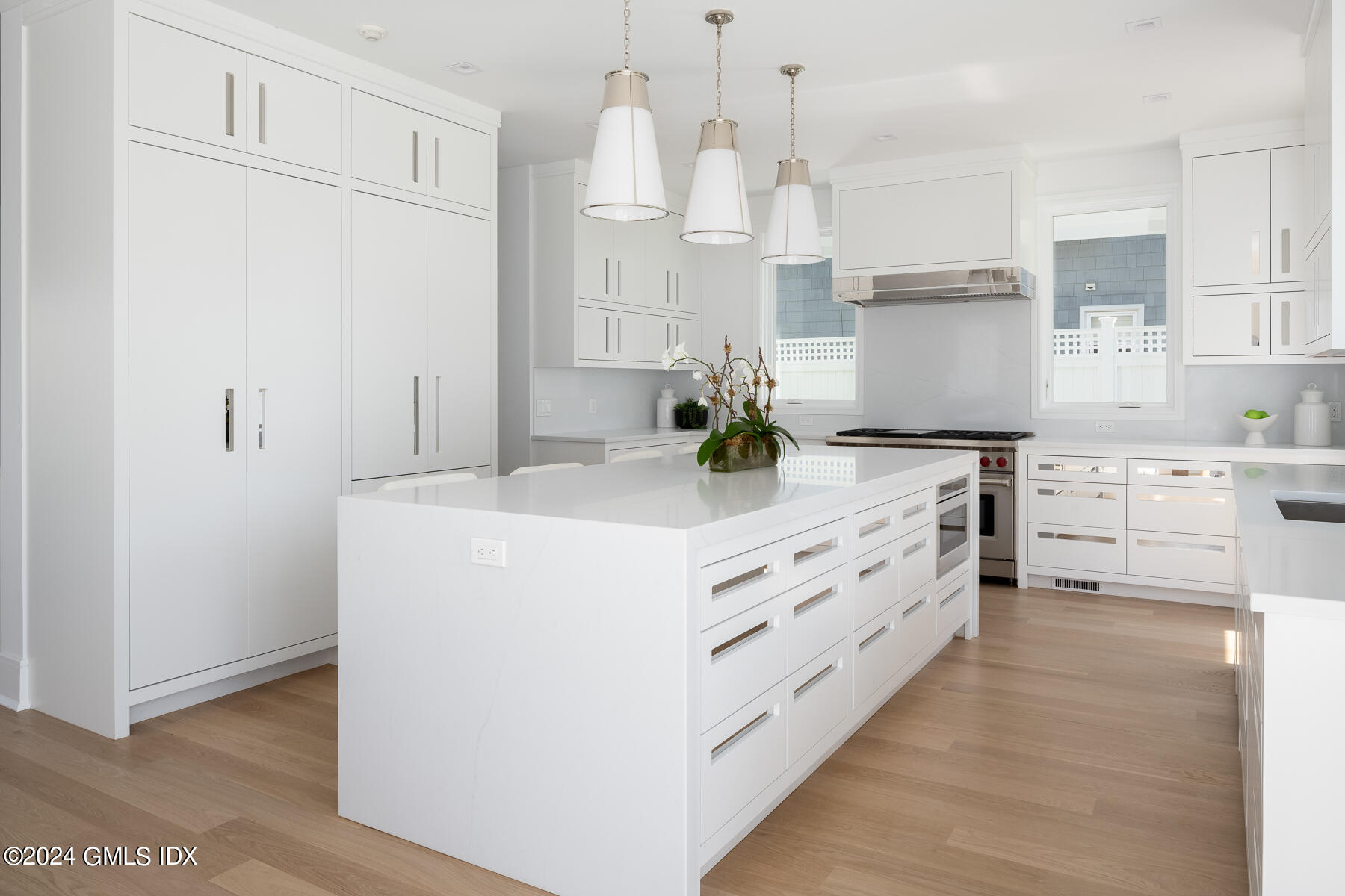 151 East Elm Street Greenwich, CT 06830 - Photo 5 of 29 a kitchen with kitchen island granite countertop a white cabinets and stainless steel appliances