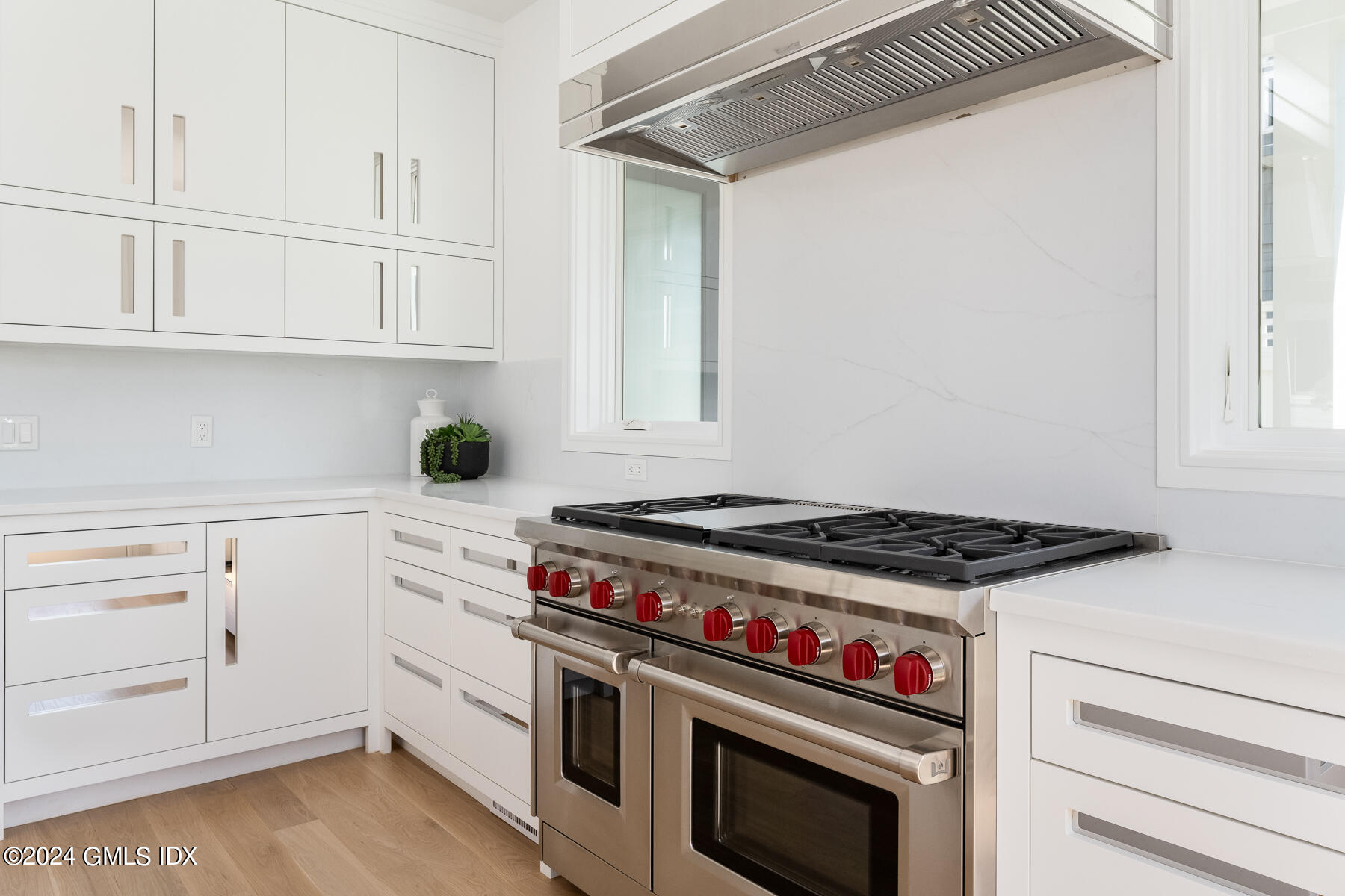 151 East Elm Street Greenwich, CT 06830 - Photo 7 of 29 a stove top oven sitting inside of a kitchen
