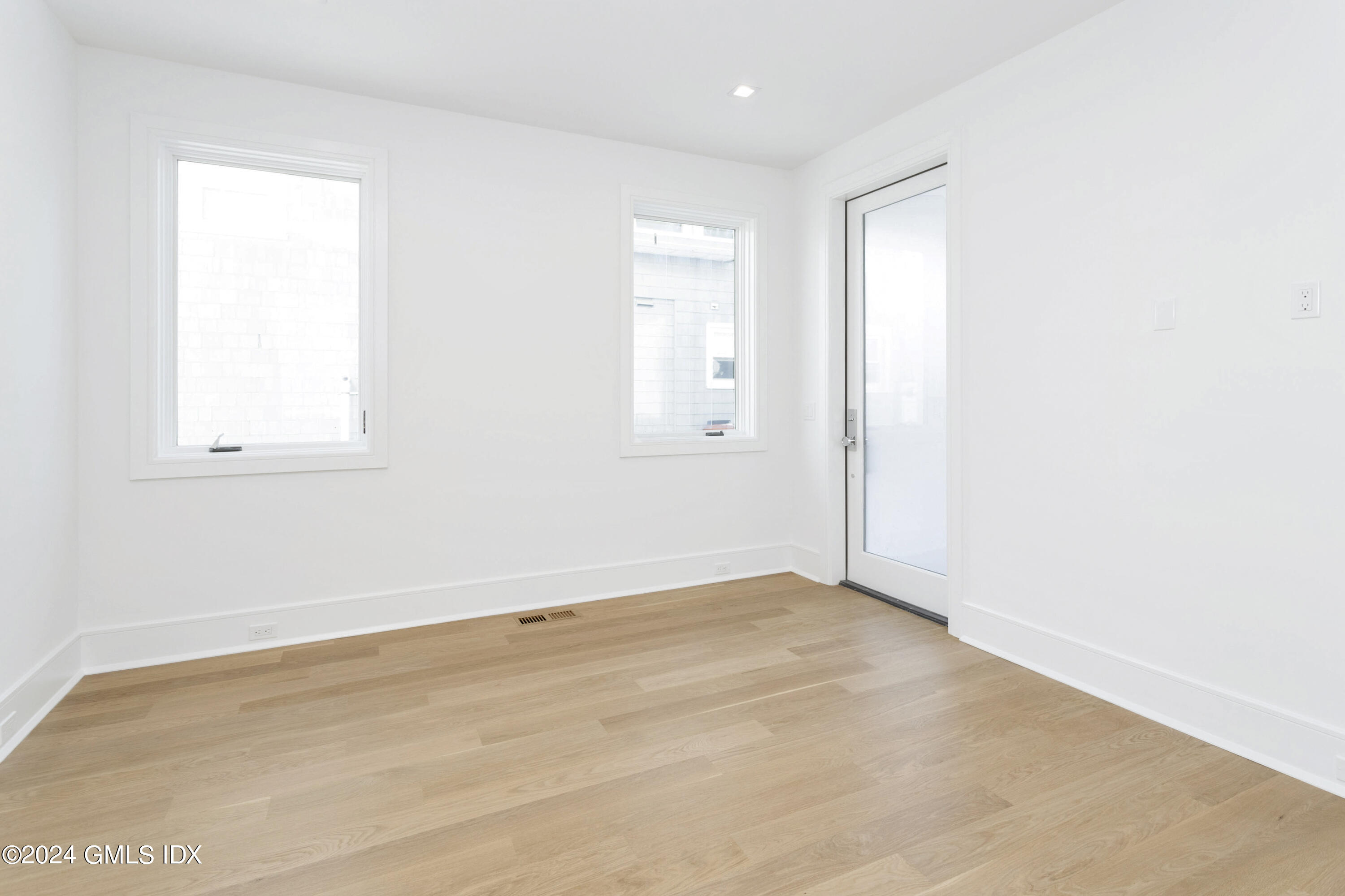 151 East Elm Street Greenwich, CT 06830 - Photo 9 of 29 an empty room with a window