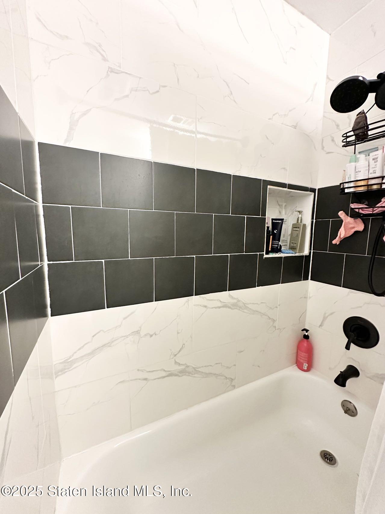 453 Ilyssa Way Staten Island, NY 10312 - Photo 13 of 16 a bathroom with a bathtub