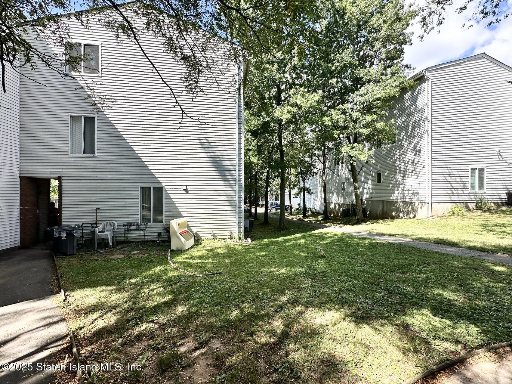 453 Ilyssa Way Staten Island, NY 10312 - Photo 16 of 16 a view of a backyard with a garden