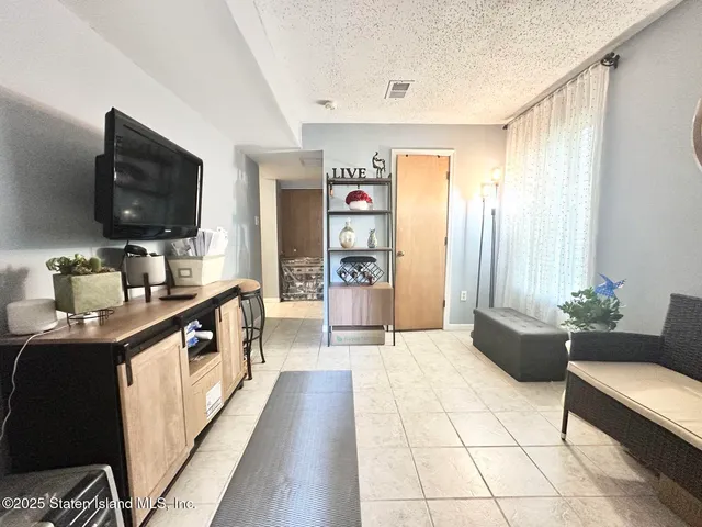 a kitchen with stainless steel appliances a sink and a refrigerator