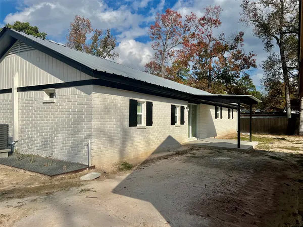 a house with trees in the background