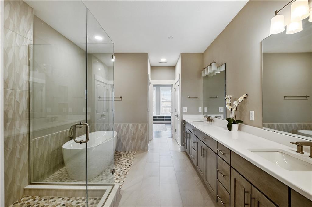 312 High Pointe Drive Seven Fields, PA 16046 - Photo 13 of 25 a bathroom with double vanity sinks double vanity shower and a mirror