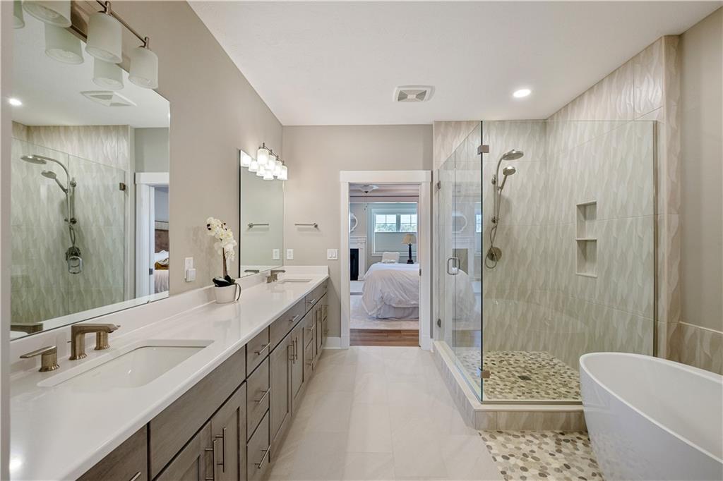 312 High Pointe Drive Seven Fields, PA 16046 - Photo 14 of 25 a bathroom with a double vanity sink a toilet a mirror and shower