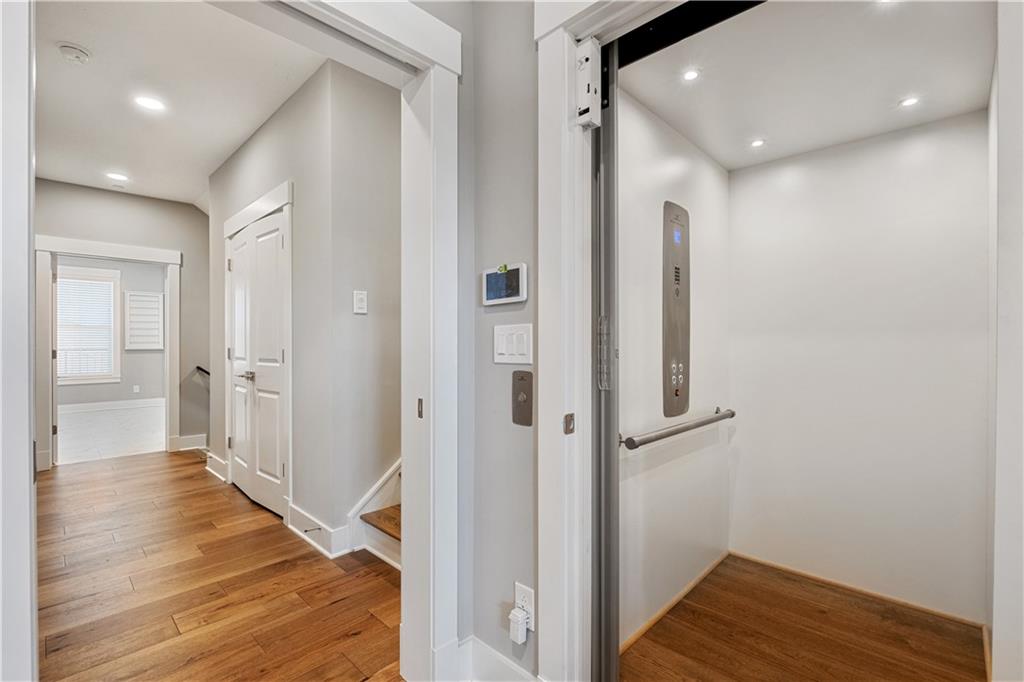 312 High Pointe Drive Seven Fields, PA 16046 - Photo 17 of 25 a view of a hallway with wooden floor and staircase