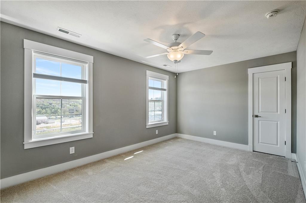 312 High Pointe Drive Seven Fields, PA 16046 - Photo 18 of 25 a view of an empty room with a window