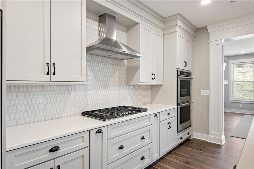 312 High Pointe Drive Seven Fields, PA 16046 - Photo 8 of 25 a kitchen with white cabinets and appliances
