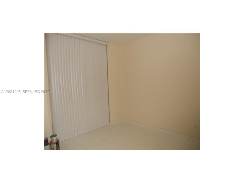2525 Southwest 3rd Avenue, Unit 1006 Miami, FL 33129 - Photo 9 of 13 a picture of wall with window