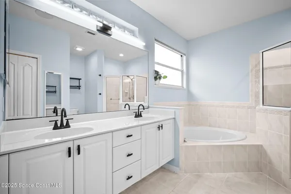 a room with a sink and a mirror