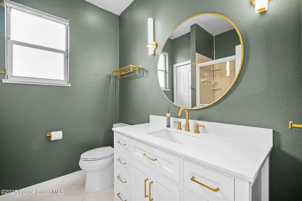 an aerial view of a house with a lake view