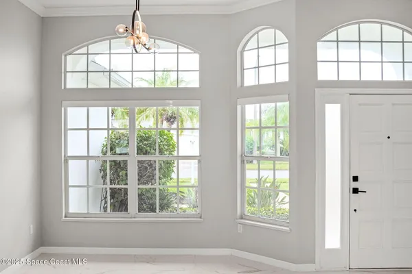 a kitchen with kitchen island a counter top space a sink stainless steel appliances and cabinets
