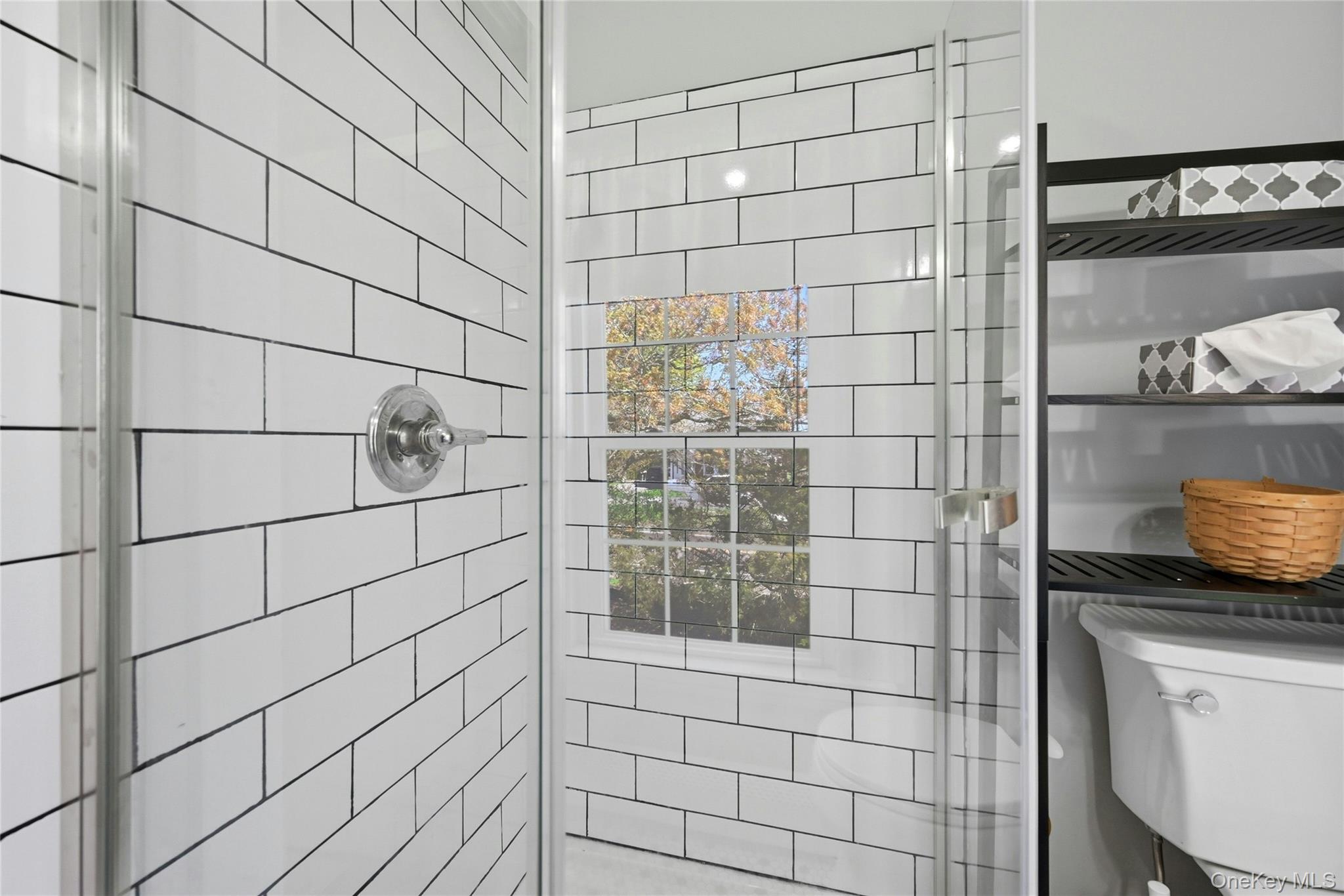 35950 Main Road Cutchogue, NY 11935 - Photo 16 of 23 a bathroom with a shower and a sink