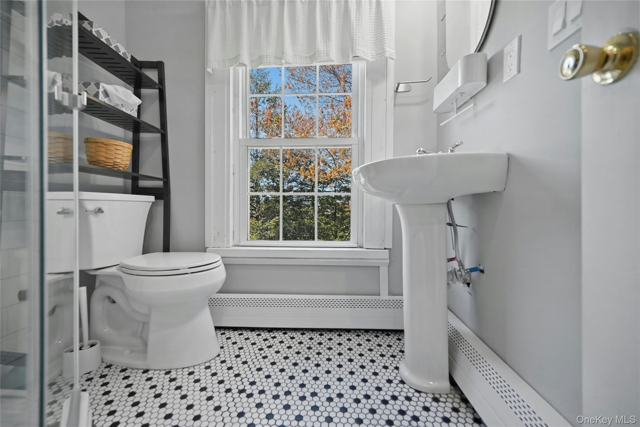35950 Main Road Cutchogue, NY 11935 - Photo 17 of 23 a bathroom with a sink toilet and shower