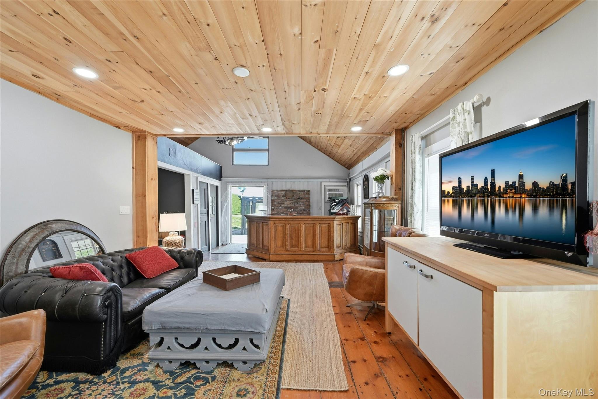 35950 Main Road Cutchogue, NY 11935 - Photo 6 of 23 a living room with furniture kitchen view and a large window