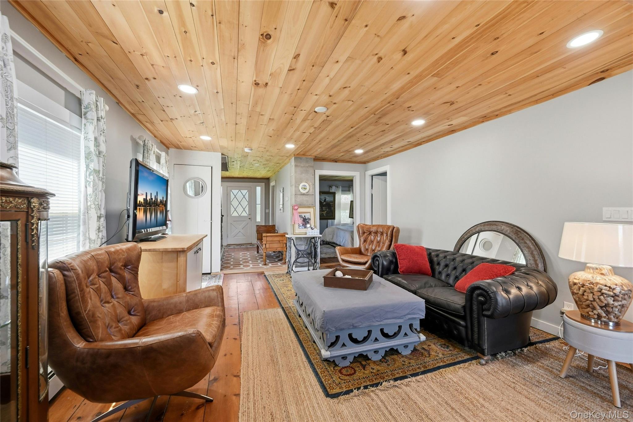 35950 Main Road Cutchogue, NY 11935 - Photo 7 of 23 a living room with furniture a rug and a chandelier
