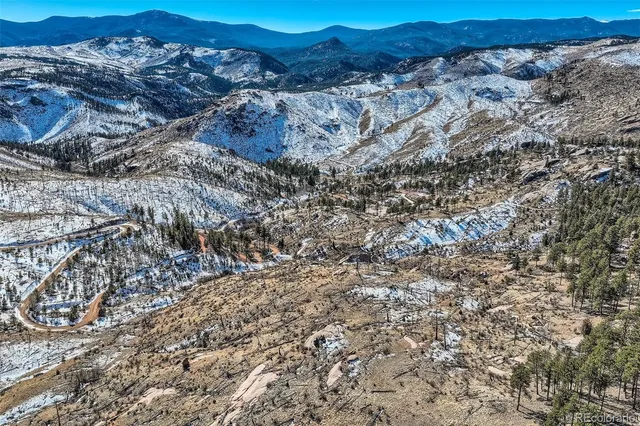 a view of mountain and tree