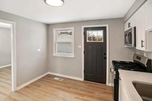 a view of kitchen and front door