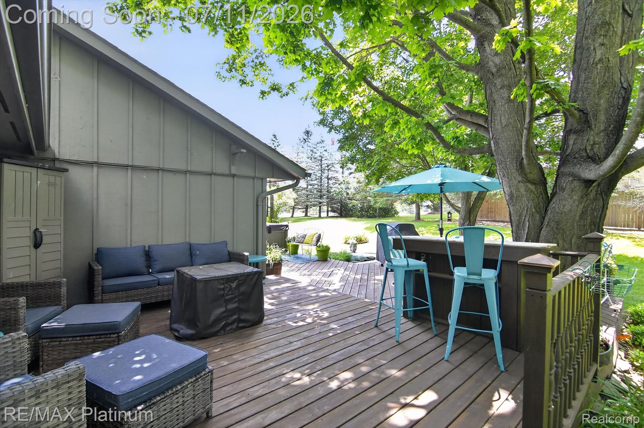 13365 North Territorial Road Gregory, MI 48137 - Photo 43 of 52 Expansive wooden deck featuring an integrated bar and perimeter railing