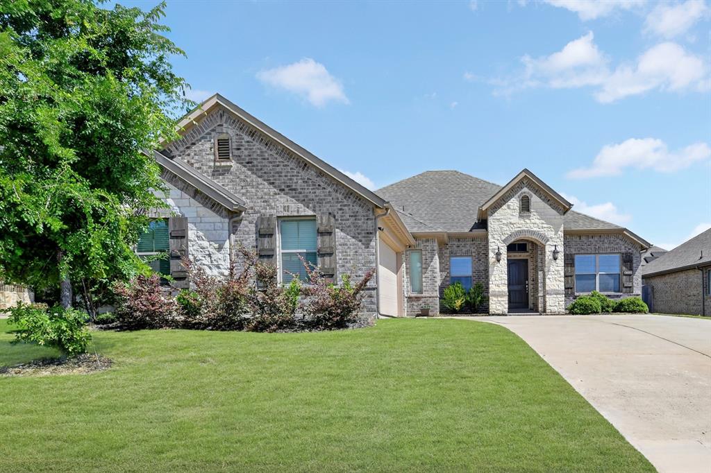 136 Gleeson Drive Red Oak, TX 75154 - Photo 3 of 40 a front view of a house with garden