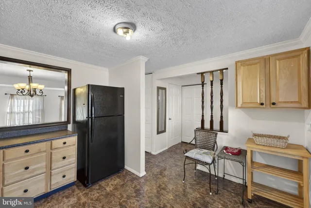 a living room with furniture a lamp and a window