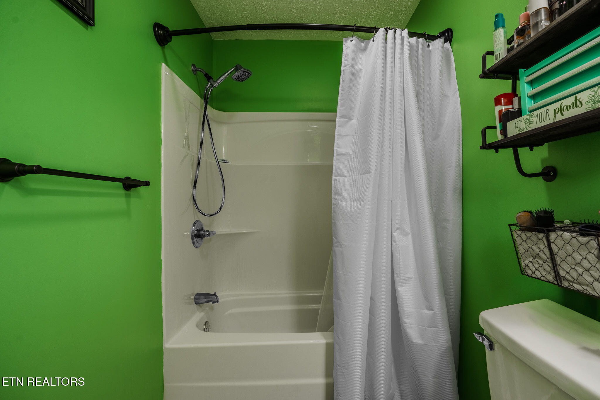 3215 Smith Road White Pine, TN 37890 - Photo 10 of 28 a bathroom with a shower and a tub