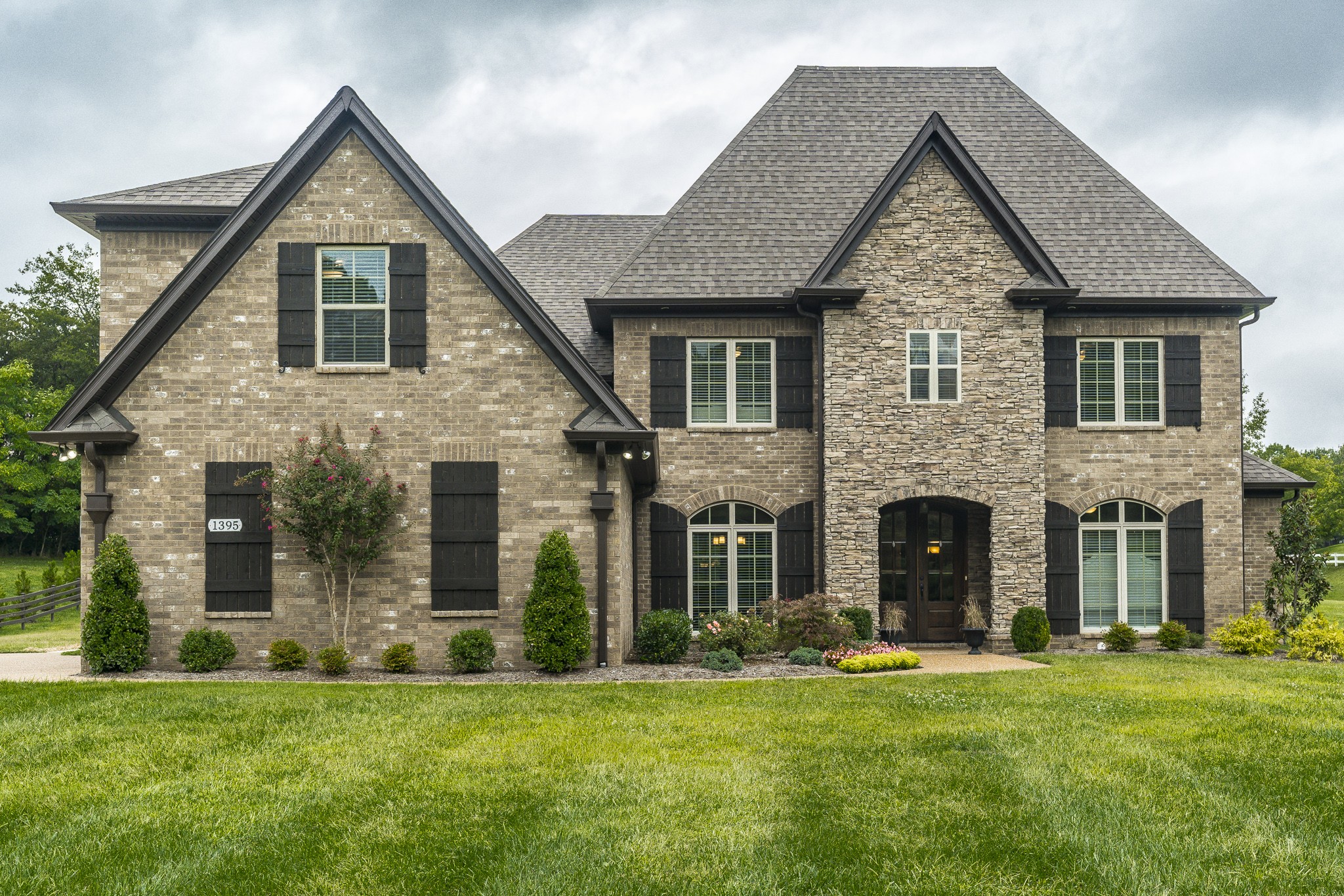 1395 Center Point Road Hendersonville, TN 37075 - Photo 1 of 50 a front view of a house with a yard and garage