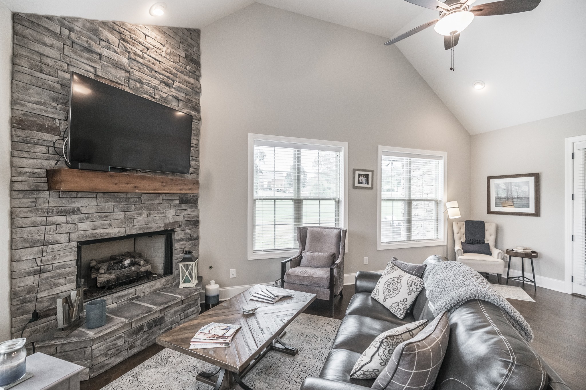 1395 Center Point Road Hendersonville, TN 37075 - Photo 18 of 50 a living room with furniture a flat screen tv and a fireplace