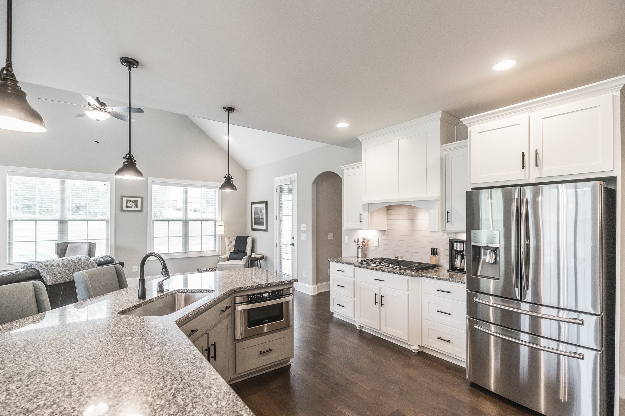 1395 Center Point Road Hendersonville, TN 37075 - Photo 21 of 50 a kitchen with stainless steel appliances granite countertop a refrigerator a sink dishwasher a stove and a dining table with wooden floor