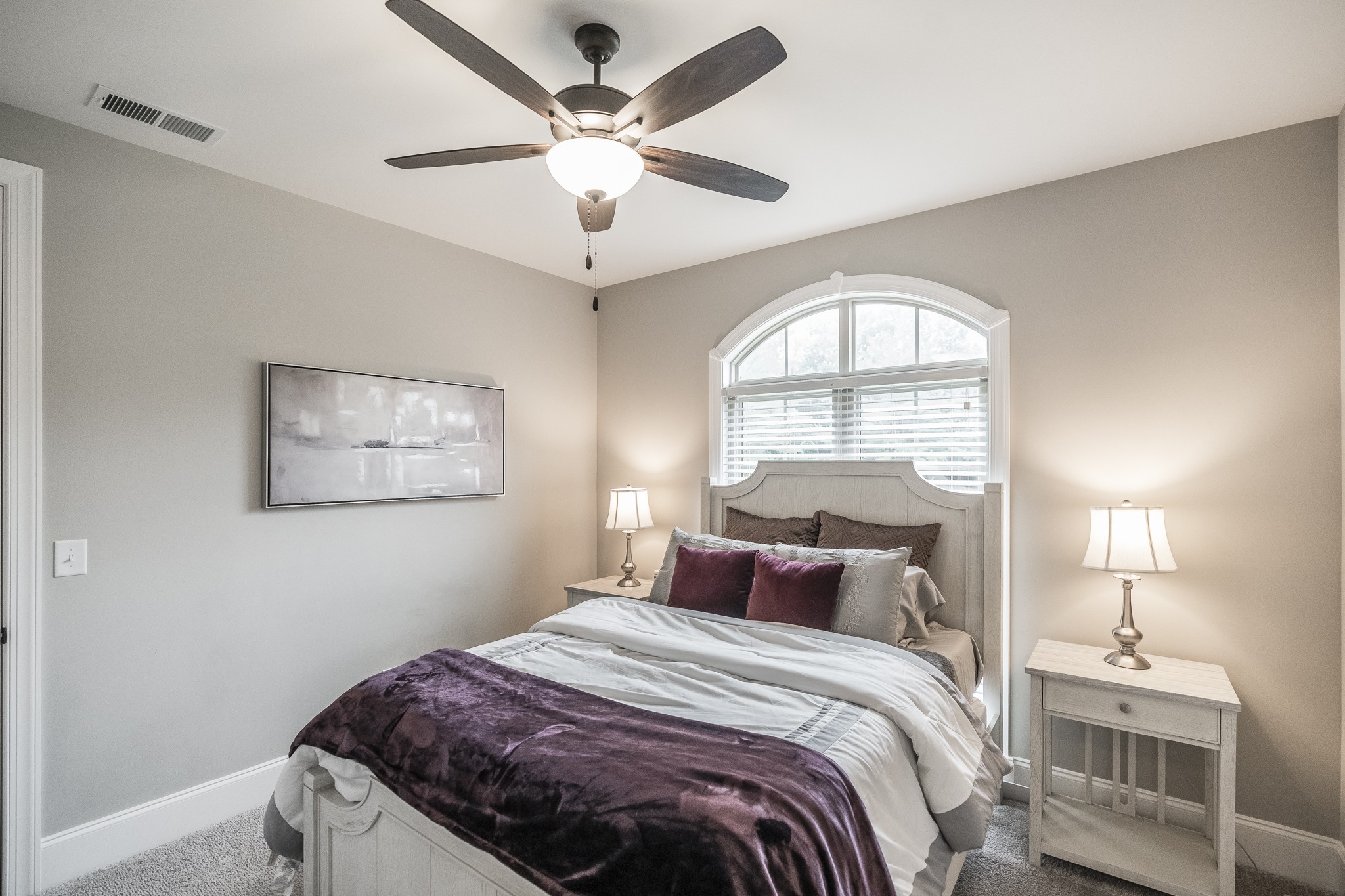 1395 Center Point Road Hendersonville, TN 37075 - Photo 34 of 50 a bedroom with a large bed and a chandelier
