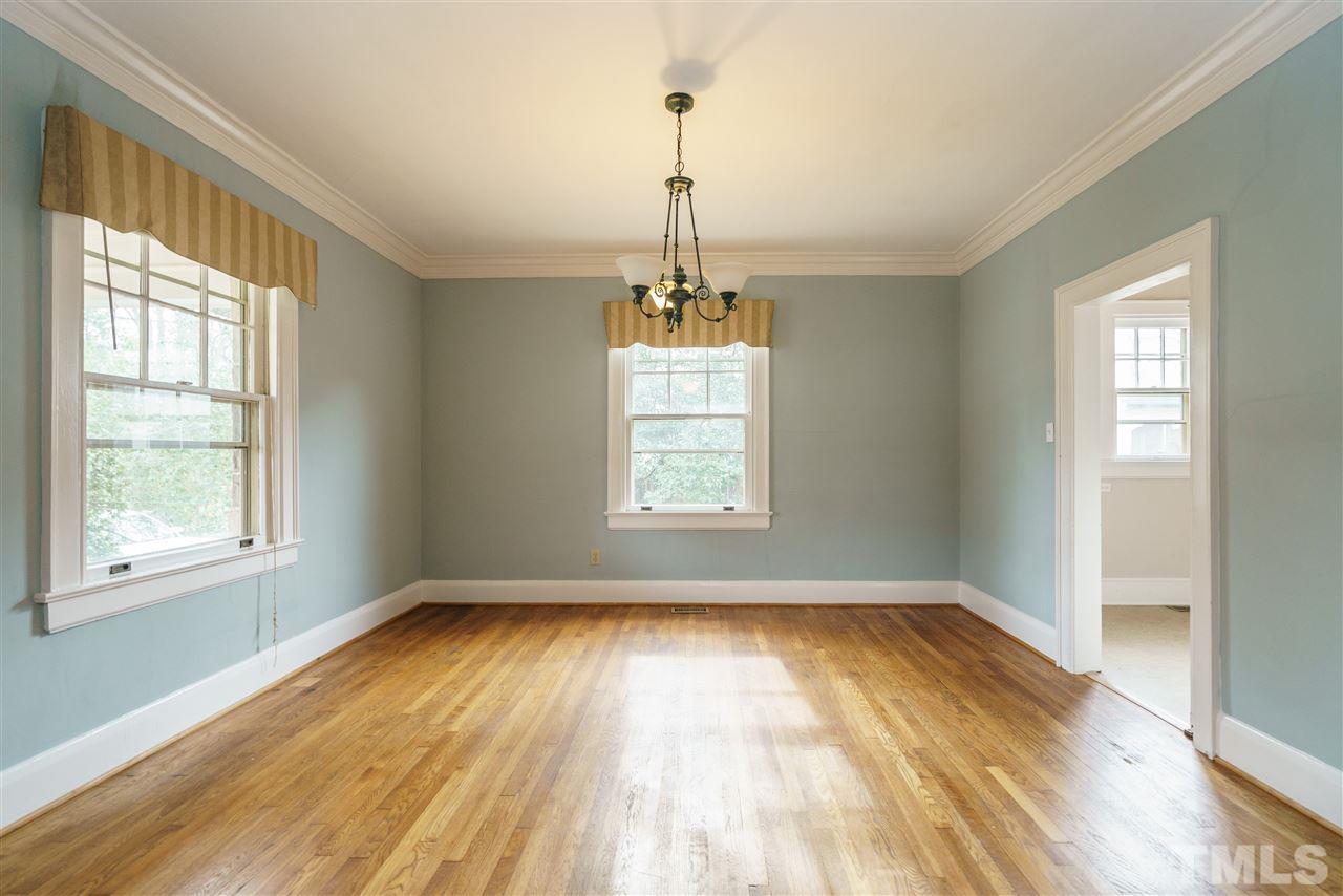 2415 Fairview Road Raleigh, NC 27608 - Photo 5 of 24 a view of empty room with wooden floor and fan