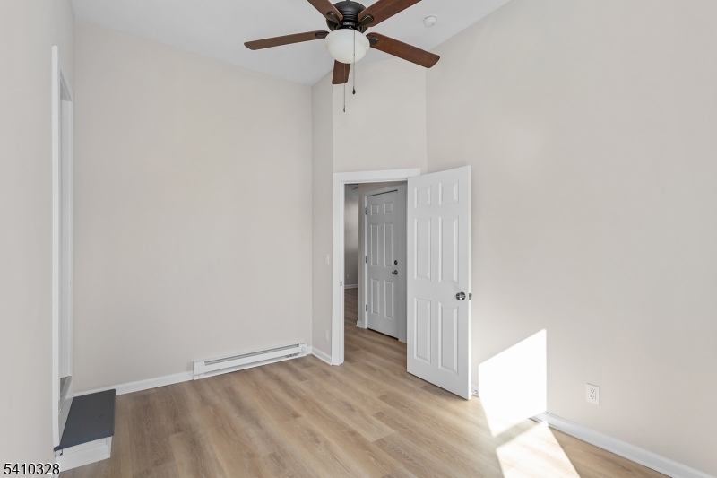 129 Main Street, Unit 3 Bloomingdale, NJ 07403 - Photo 13 of 21 wooden floor in an empty room