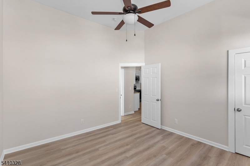 129 Main Street, Unit 3 Bloomingdale, NJ 07403 - Photo 18 of 21 wooden floor in an empty room
