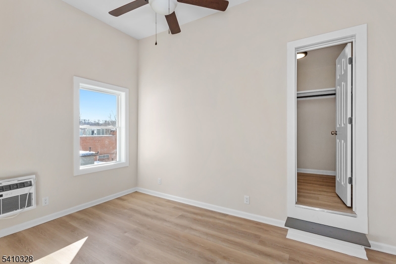 129 Main Street, Unit 3 Bloomingdale, NJ 07403 - Photo 20 of 21 a view of an empty room and window