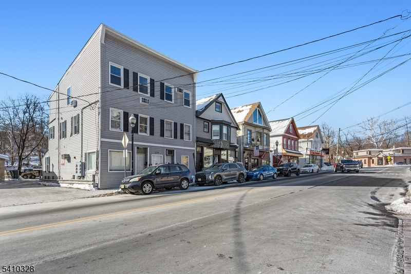129 Main Street, Unit 3 Bloomingdale, NJ 07403 - Photo 21 of 21 a city street lined with buildings and cars