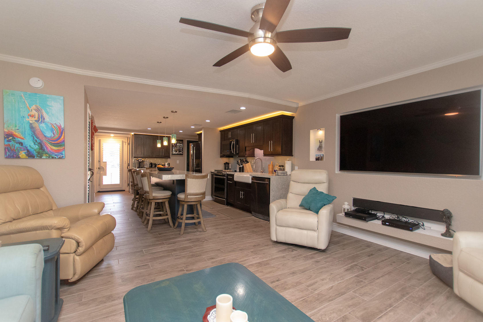 97652 Overseas Highway, Unit M11 Key Largo, FL 33037 - Photo 15 of 48 a living room with furniture and a flat screen tv