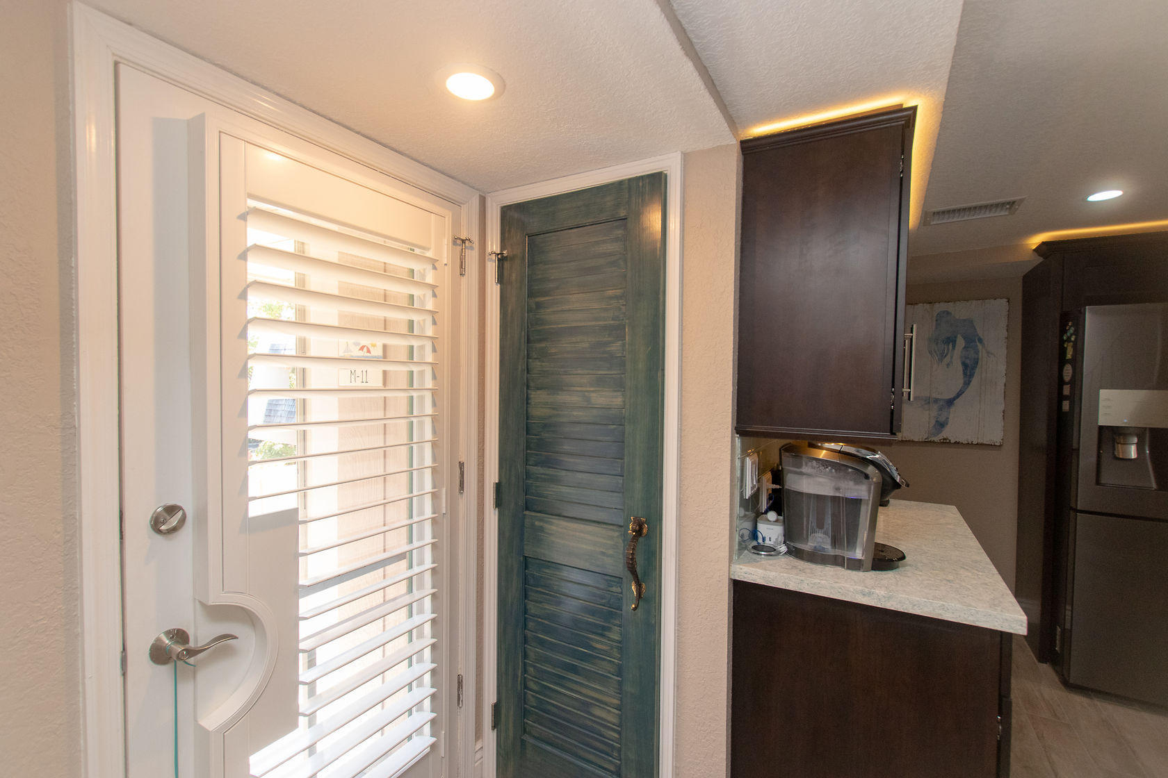 97652 Overseas Highway, Unit M11 Key Largo, FL 33037 - Photo 18 of 48 a bathroom with a sink a toilet and shower