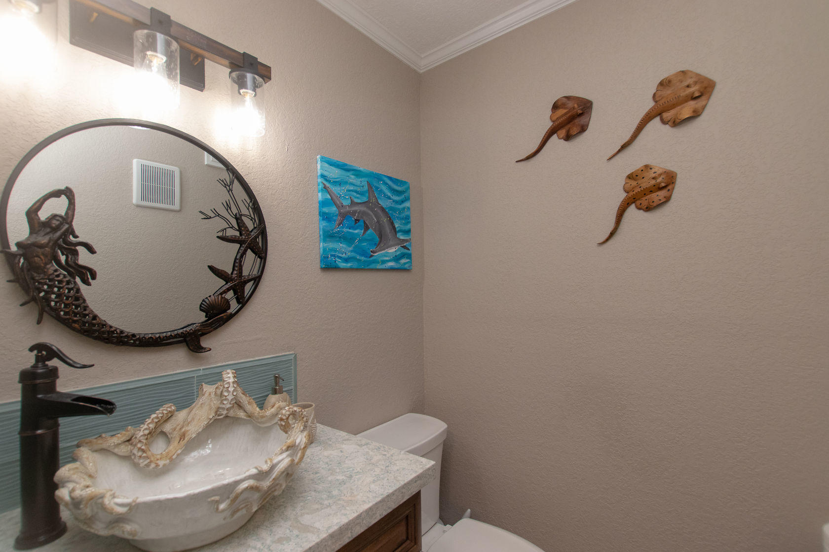 97652 Overseas Highway, Unit M11 Key Largo, FL 33037 - Photo 19 of 48 a bathroom with a sink and mirror