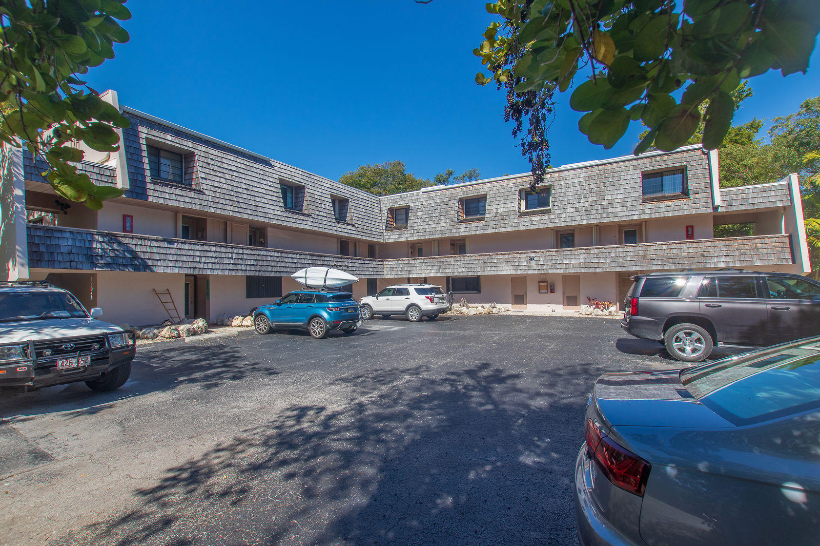 97652 Overseas Highway, Unit M11 Key Largo, FL 33037 - Photo 2 of 48 a car parked in front of a house
