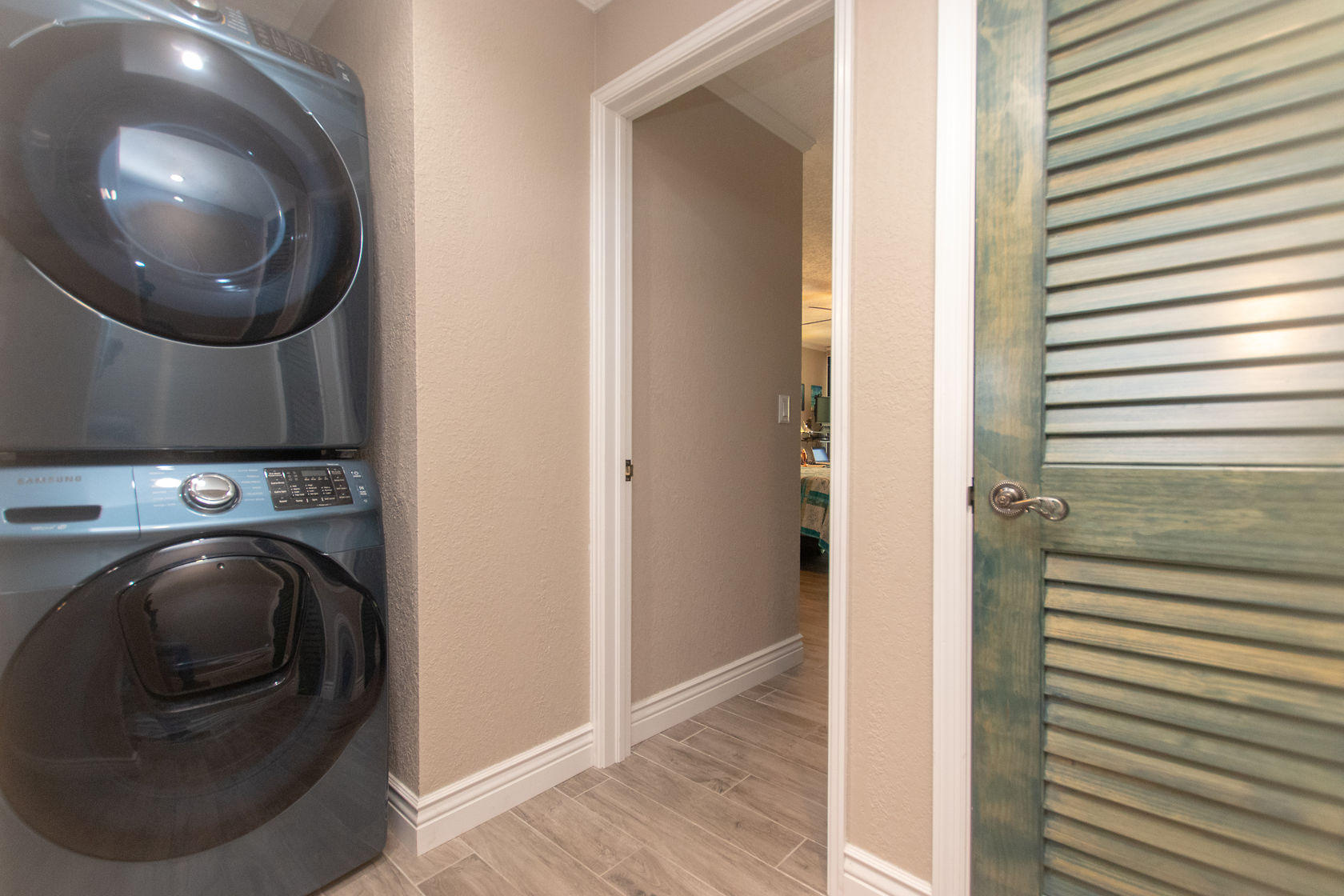97652 Overseas Highway, Unit M11 Key Largo, FL 33037 - Photo 23 of 48 a view of a hallway with washer and dryer