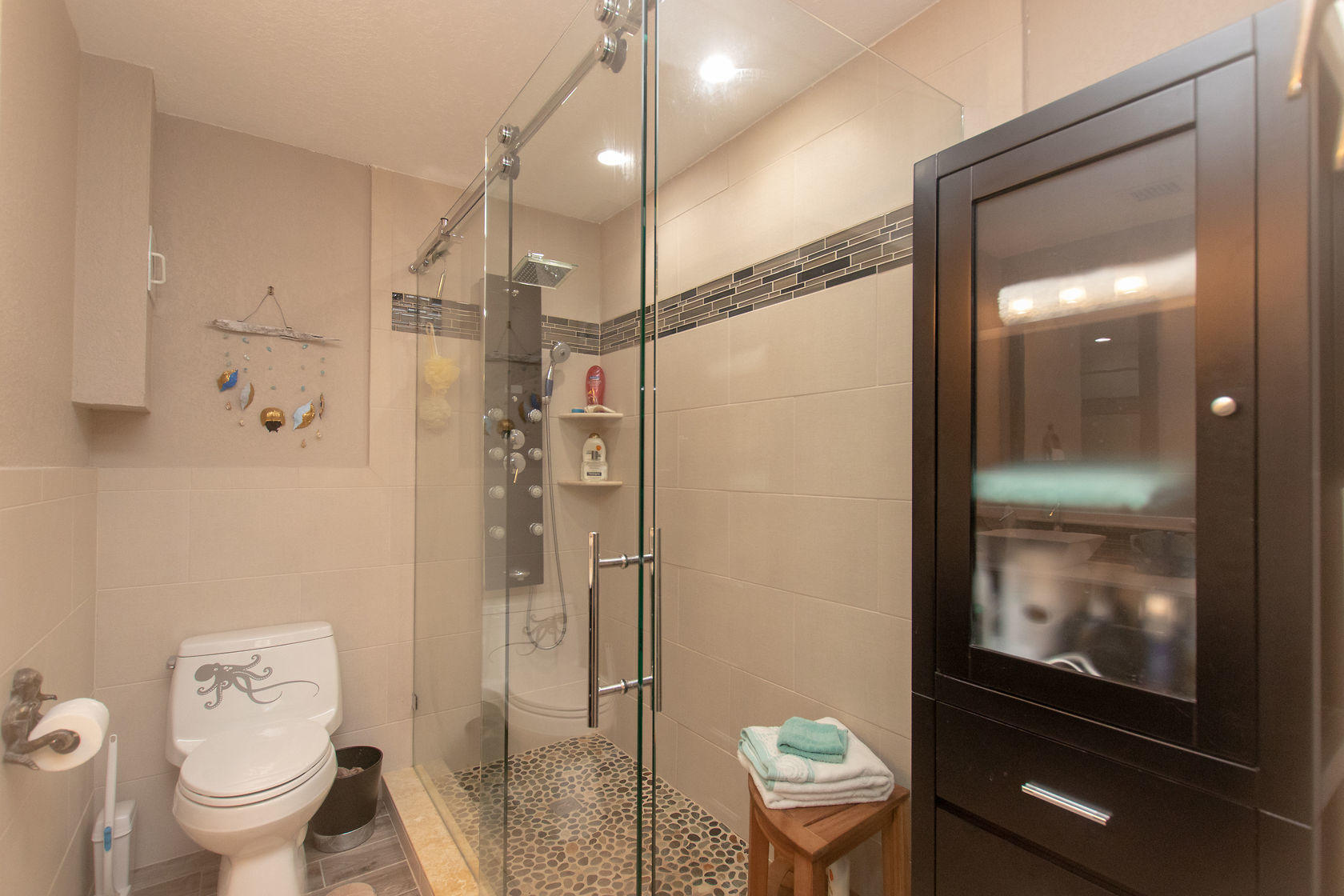 97652 Overseas Highway, Unit M11 Key Largo, FL 33037 - Photo 30 of 48 a bathroom with a toilet a sink and shower