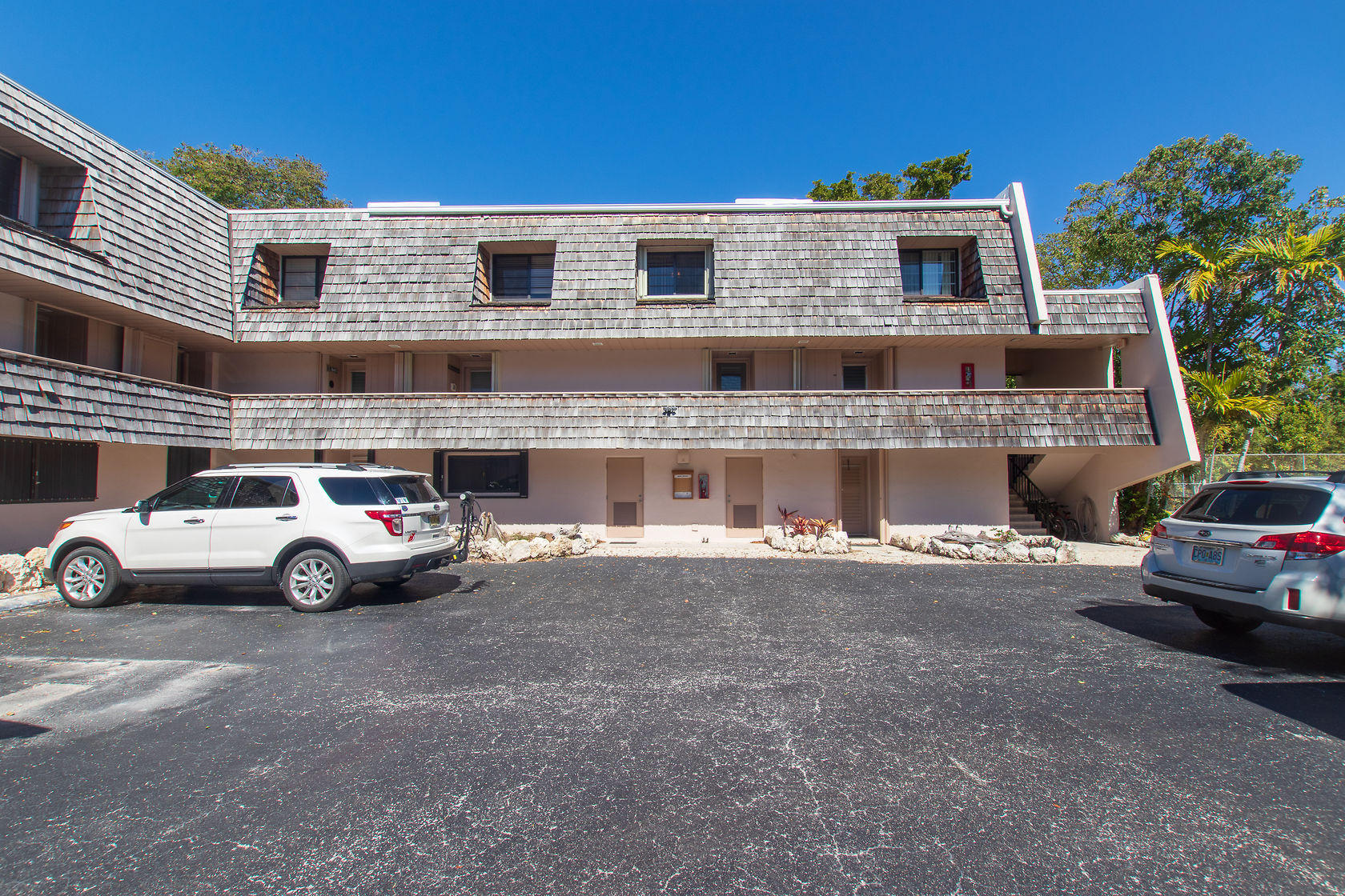 97652 Overseas Highway, Unit M11 Key Largo, FL 33037 - Photo 3 of 48 a view of street with parked cars