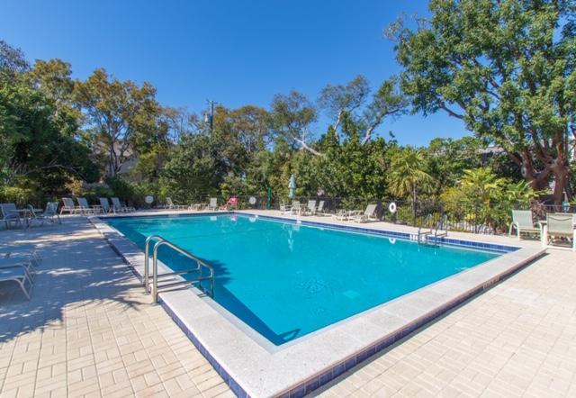 97652 Overseas Highway, Unit M11 Key Largo, FL 33037 - Photo 48 of 48 a view of a swimming pool with a yard